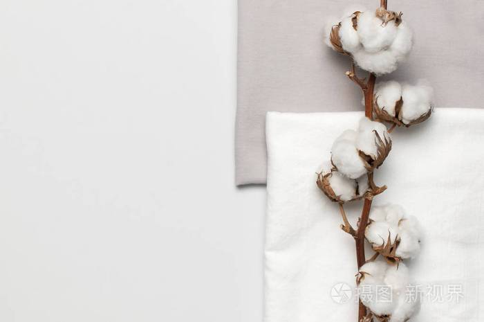 精致的白色棉花.浅棉质背景.生态纺织品照片-正版商用图片